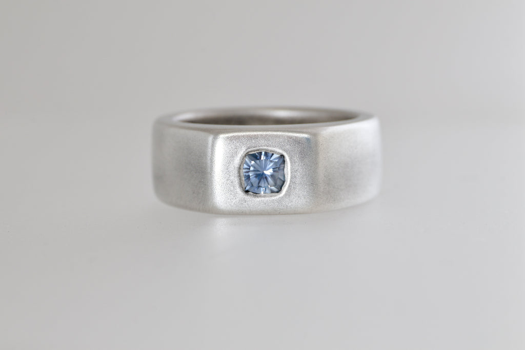 Satin sterling silver signet ring with light blue Umba sapphire cushion