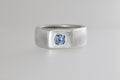 Satin sterling silver signet ring with light blue Umba sapphire cushion