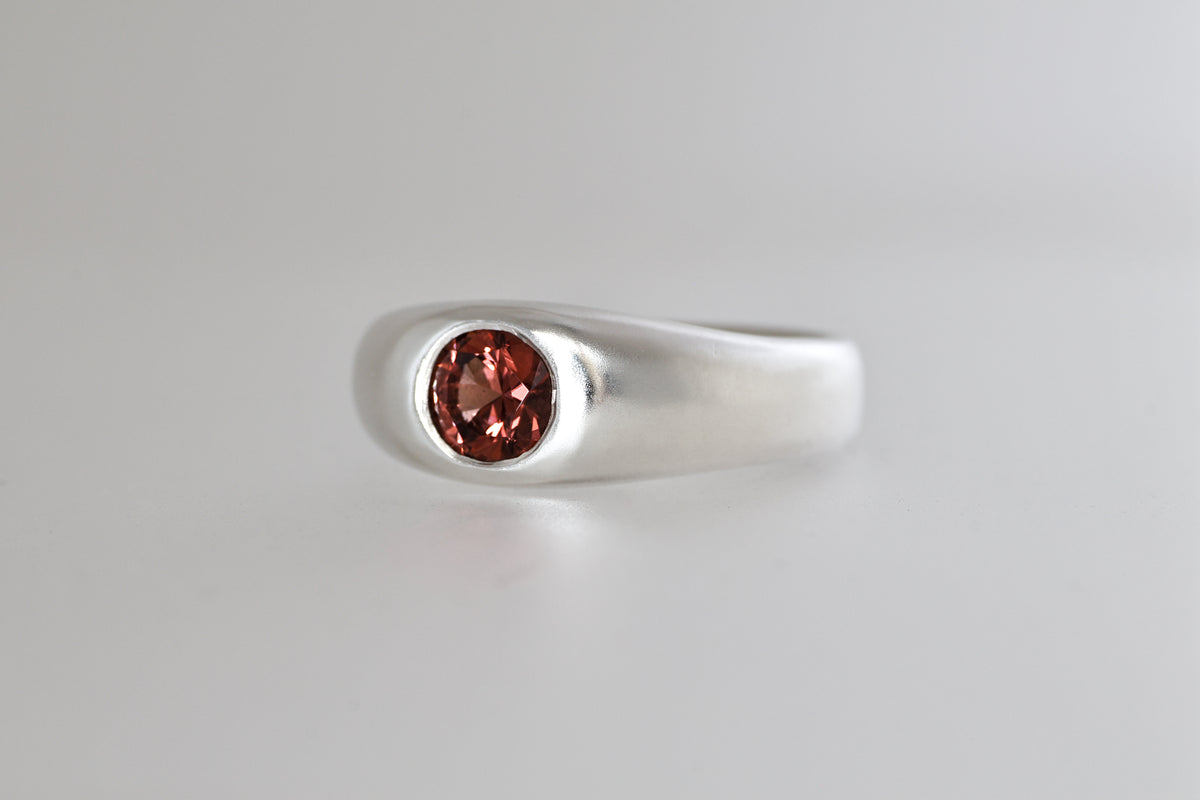 Brushed sterling silver signet ring with red-orange Malaya garnet